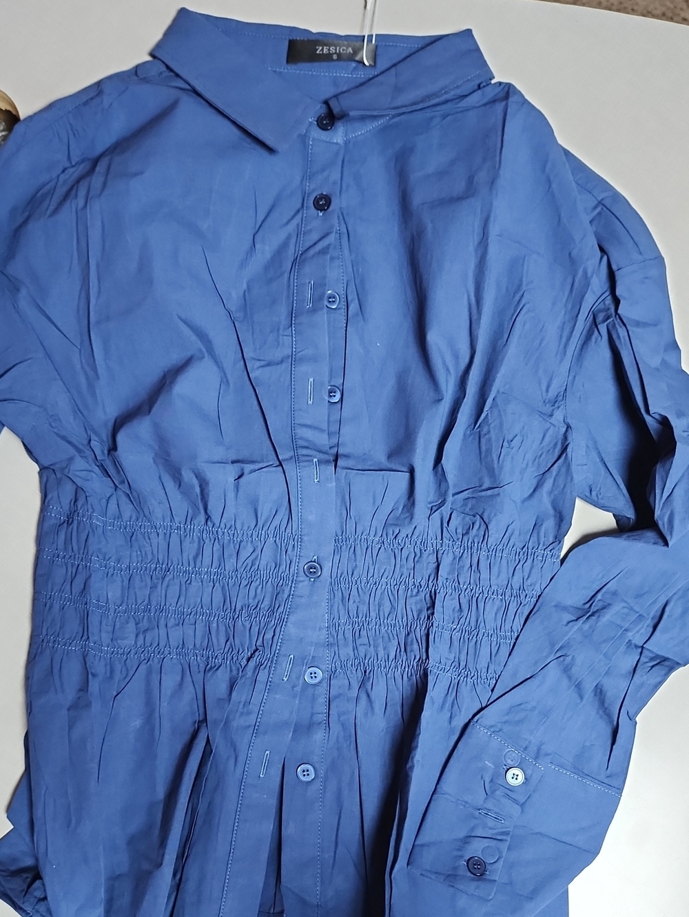 Navy rouched waist button up women's blouse.